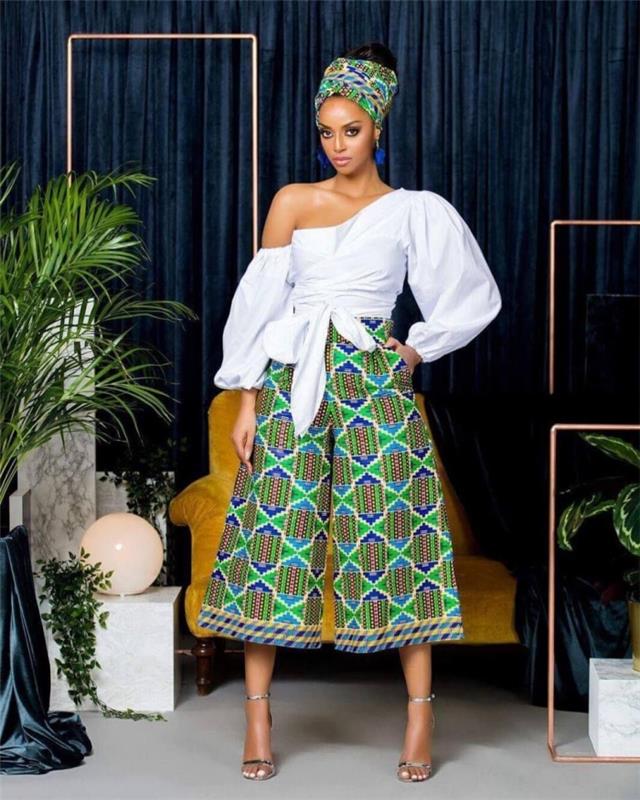 Afrikos stiliaus moteriški drabužiai, plačios kelnės iš etninio rašto audinio, moterų apranga balta ir žalia