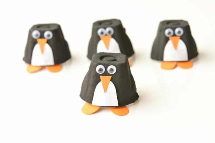 lavoretti-da-fare-con-i-bambini-pinguini-realizzati-cartone-uova-tagliati-colorati-occhi-mobili-becco-zampe